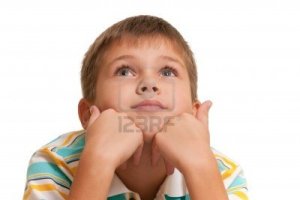 7877854-a-handsome-dreaming-boy-is-holding-his-head-on-his-hands-isolated-on-the-white-background